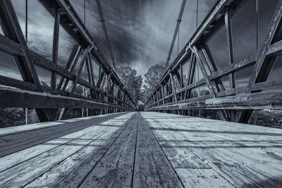 Directly below shot of bridge against sky