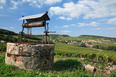 Built structure on field against sky