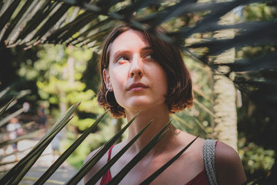 Portrait of young woman looking away