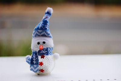 Close-up of stuffed toy on snow