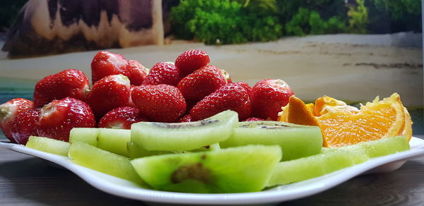 Close-up of fruits in plate on table