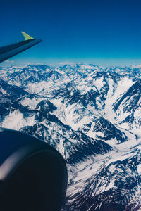 Scenic view of mountains seen through airplane window