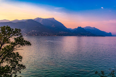 Scenic view of lake against sky during sunset