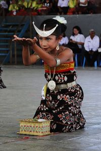 Girl in traditional clothing performing dance