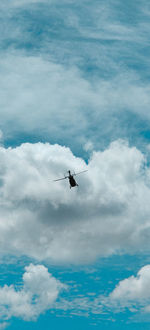 Low angle view of airplane flying in sky