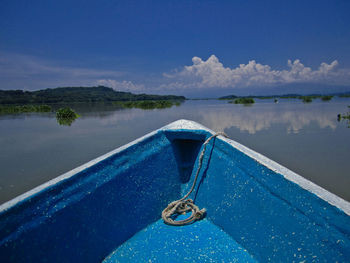 Scenic view of blue lake against sky