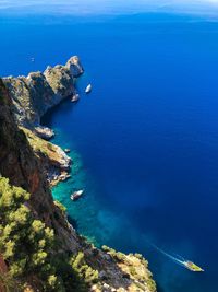 High angle view of rocks by sea