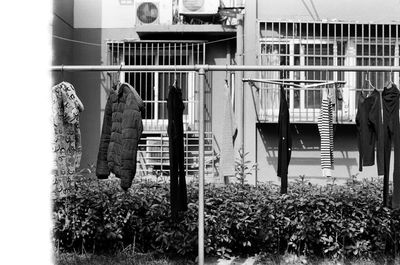 Clothes drying on railing against building