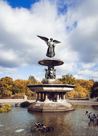 Low angle view of statue against sky