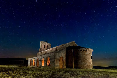 Old building against sky at night