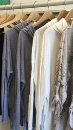 Close-up of clothes hanging in rack