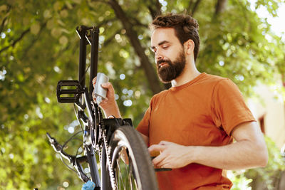 Young man with bicycle