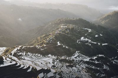 Aerial view of mountains against sky