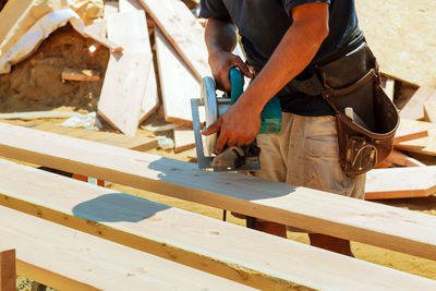 Midsection of man working at construction site