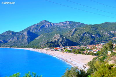 Scenic view of mountains against clear blue sky