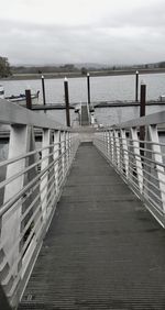 Pier over sea against sky