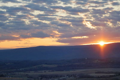 Scenic view of mountains against sky during sunset