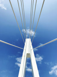 Low angle view of vapor trail against blue sky