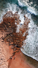 High angle view of rock in sea