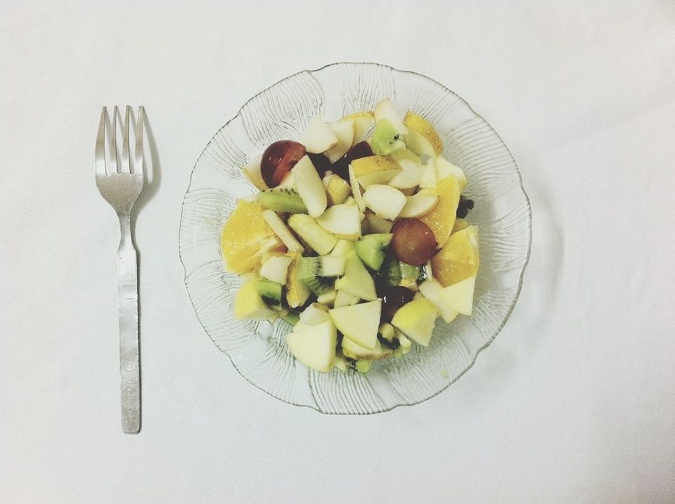 food and drink, food, freshness, indoors, healthy eating, still life, plate, table, ready-to-eat, studio shot, fruit, slice, directly above, white background, bowl, fork, high angle view, serving size, vegetable, meal