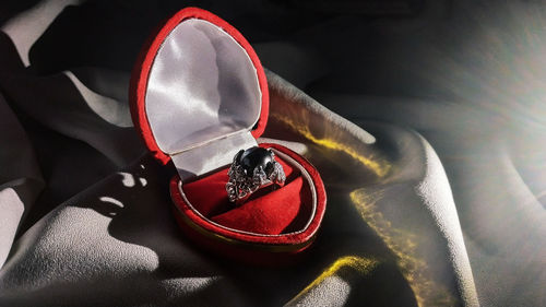 High angle view of heart shape shoes on metal