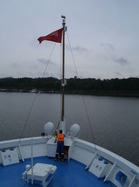 Sailboat on sea against sky