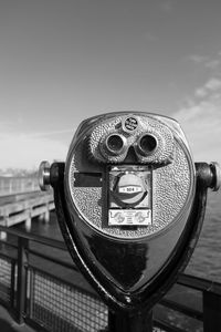 Coin-operated binoculars by river