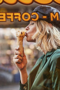 Portrait of woman holding ice cream