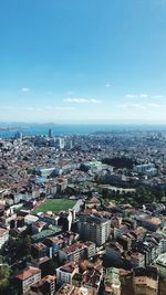 High angle view of townscape against blue sky