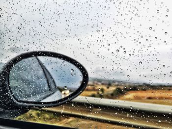 Close-up of raindrops on glass window