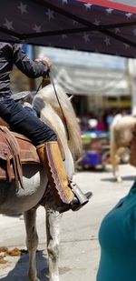 Man riding motorcycle on street in city