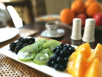 Fruits in plate on table