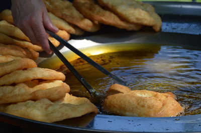 Close-up of man preparing food