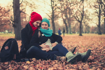 Portrait of happy friends playing in park