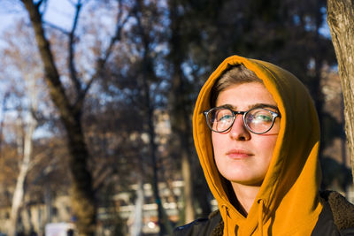 Young adult woman portrait at sunset in the park, tbilisi, georgia