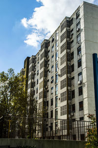 Low angle view of office building against sky