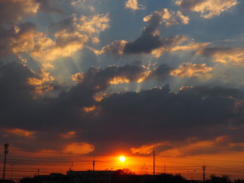 Low angle view of silhouette dramatic sky during sunset