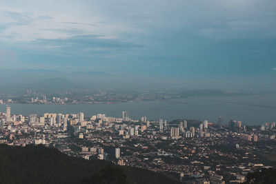 High angle view of city buildings against sky