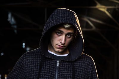 Portrait of teenage boy wearing hooded shirt