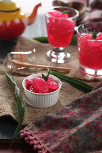 High angle view of red wine in glass on table