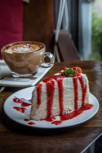 Close-up of cake slice in plate on table