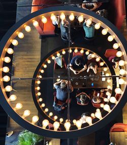High angle view of illuminated ferris wheel at night