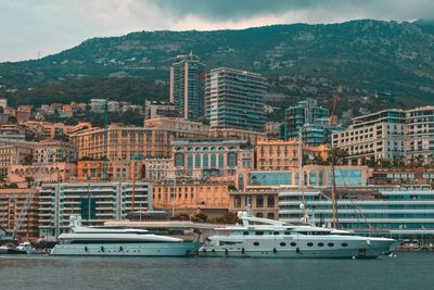 Panoramic view of sea and buildings against sky