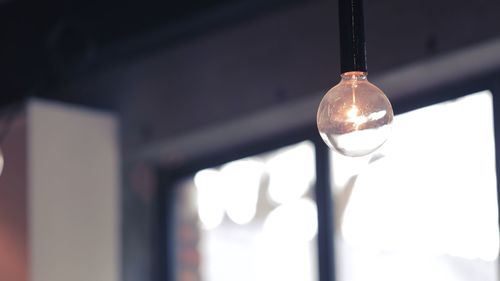 Close-up of illuminated electric bulb