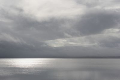 Sunshine on water on a cloudy day