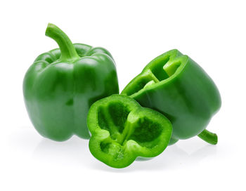 Close-up of green bell pepper against white background