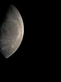 Low angle view of moon against sky at night