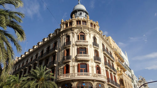 Low angle view of building against blue sky