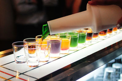 Close-up of bartender serving drinks