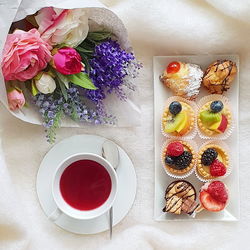 High angle view of various fruits in vase on table